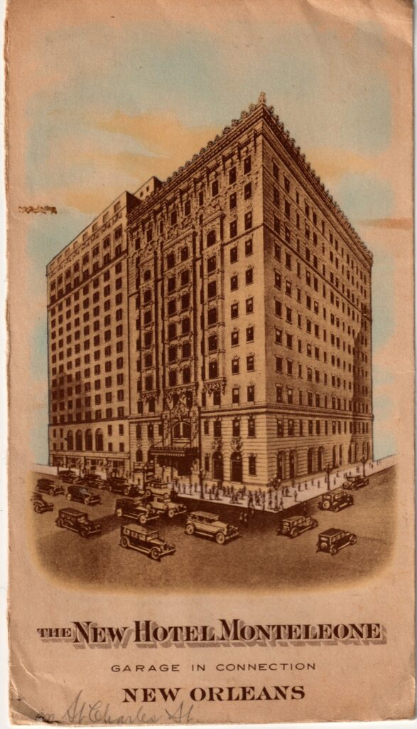 A tinted drawing of a tall brick hotel on a corner, with old cars in the street below