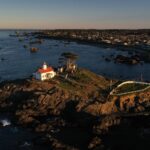 Aerial view of Battery Point Lighthouse and Crescent City at dusk