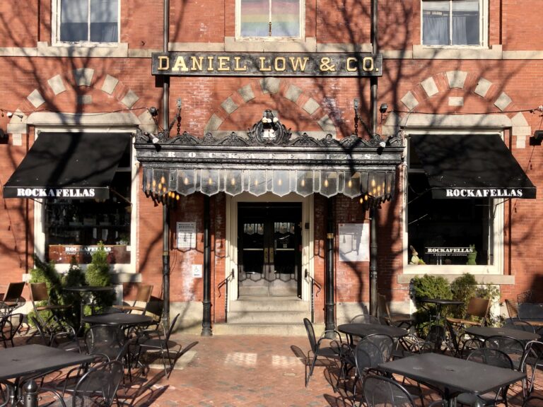 The Daniel Low & Co. building, now Rockafellas, with its lettered facade and sidewalk tables