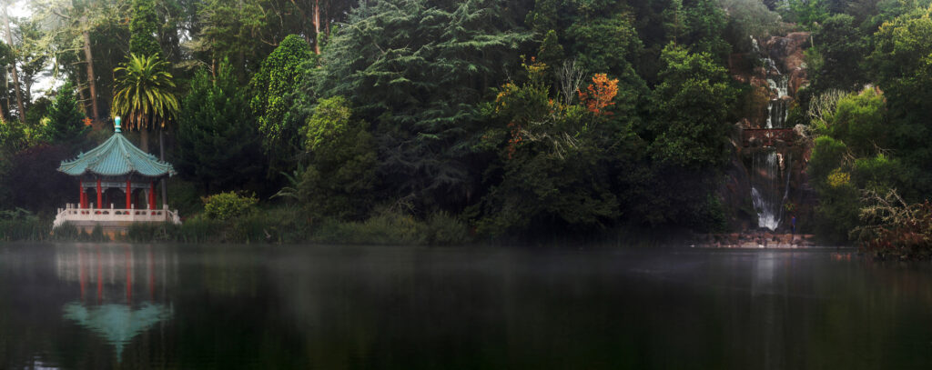 Stow Lake on a foggy morning, with the Chinese pavilion reflected in dark water