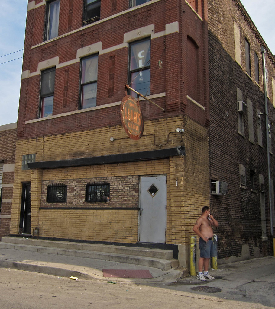 The Liar's Club's brick corner building on Fullerton Avenue, with its round sign over the door
