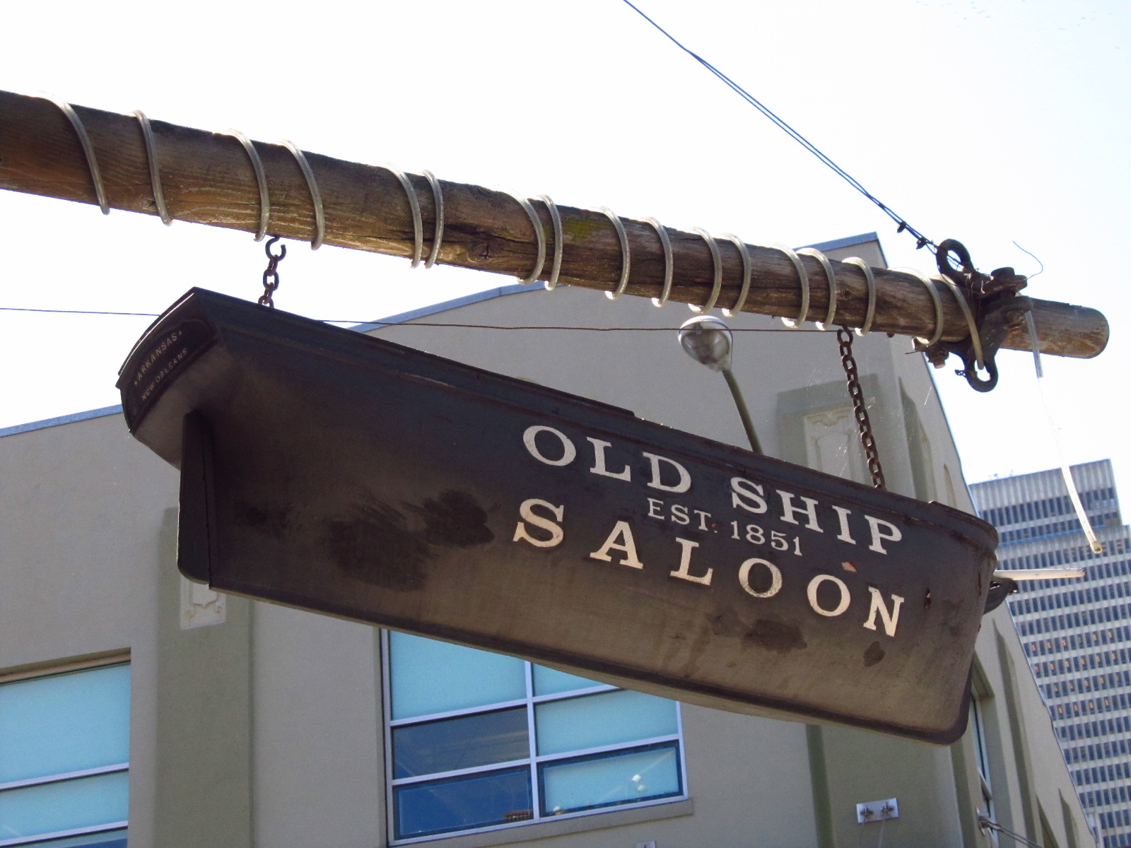 The Old Ship Saloon building seen from the sidewalk, looking up