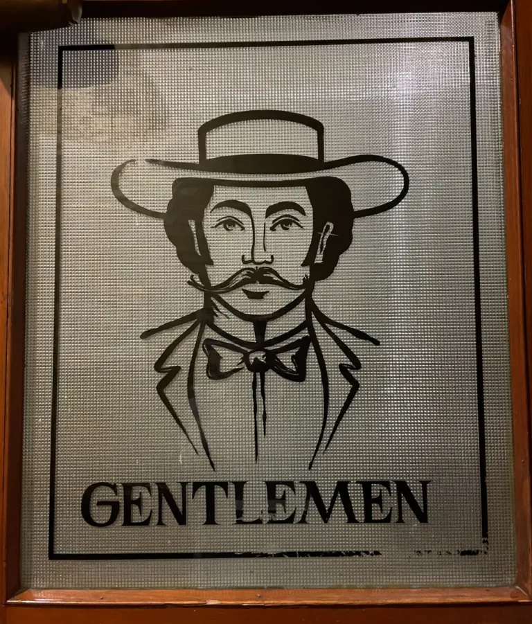 Gentlemen's restroom door in Manresa Castle
