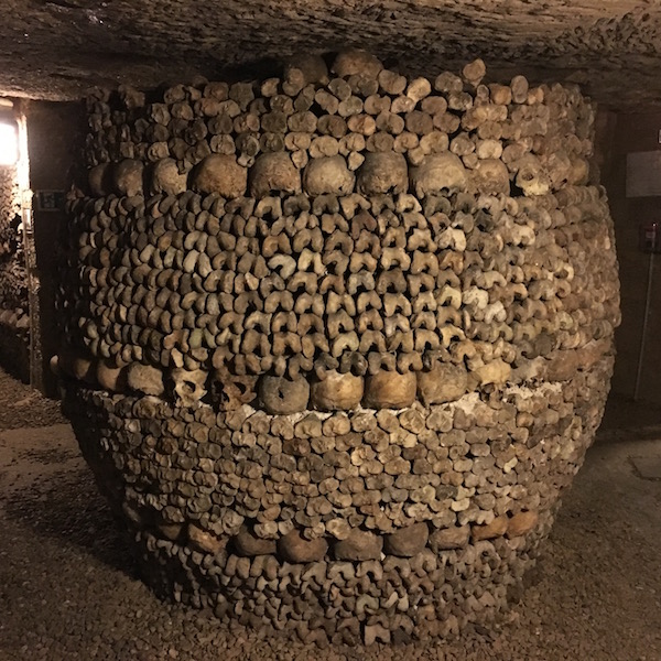 Tower of skulls and bones in the Paris Catacombs