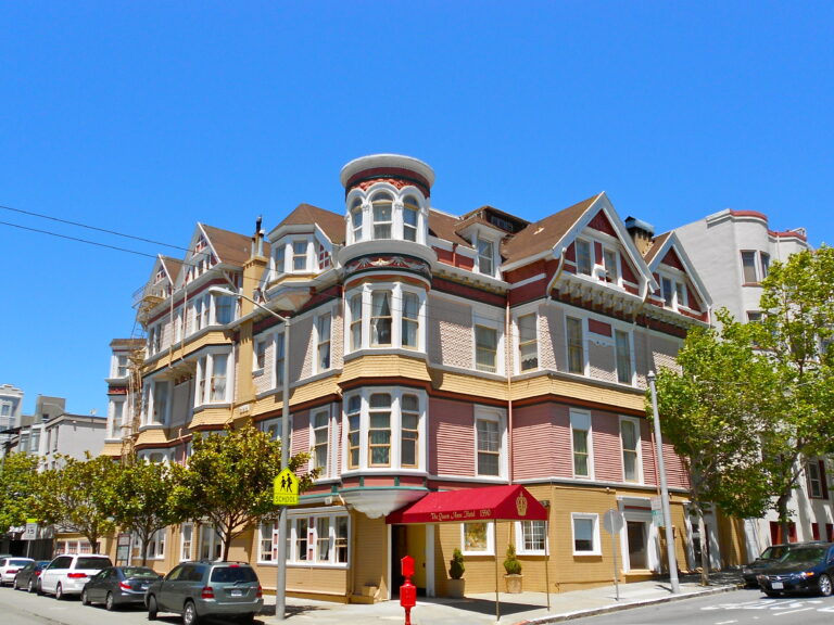 The Victorian facade of the Queen Anne Hotel at 1590 Sutter Street, seen from the street