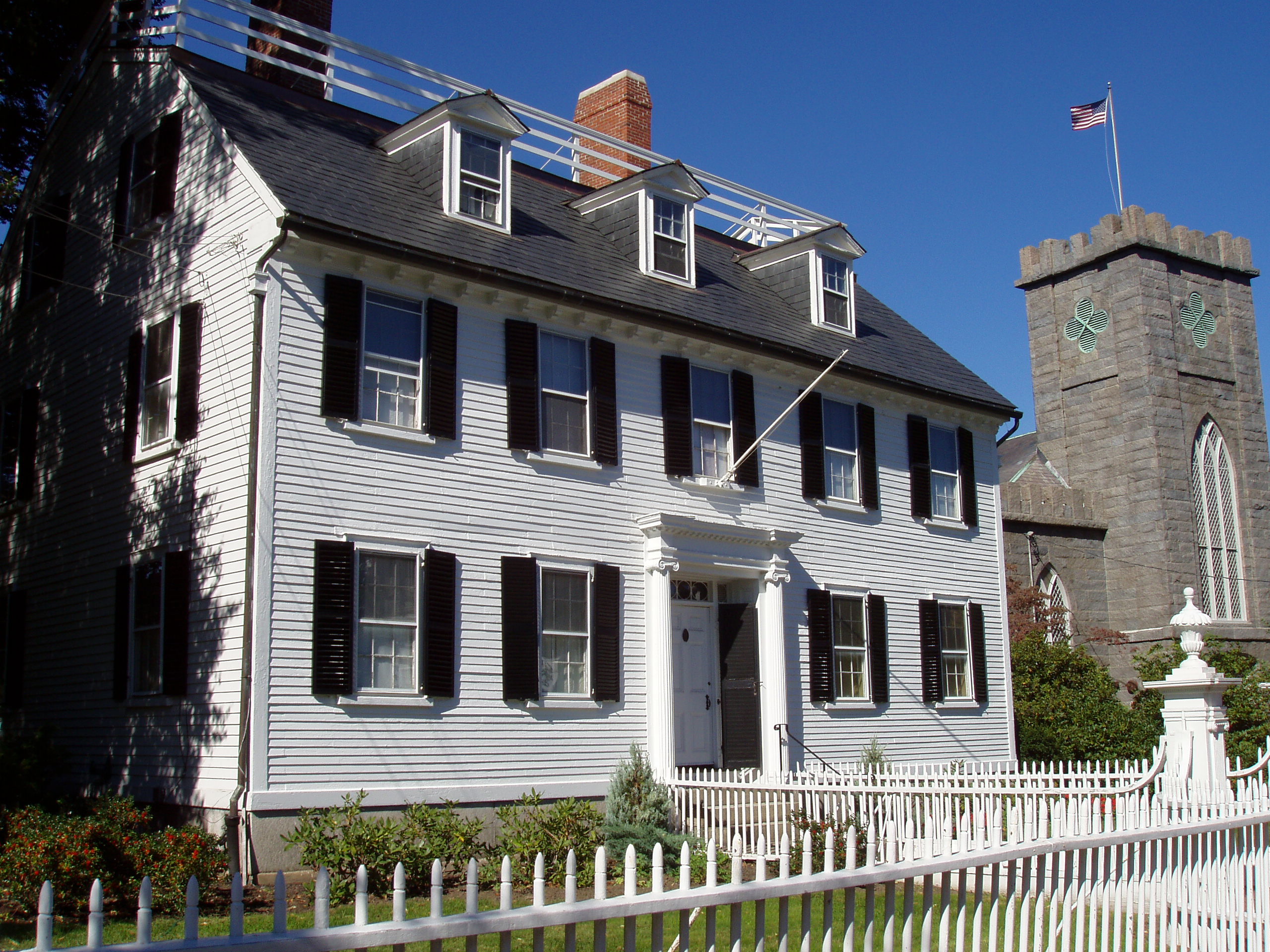 The white Ropes Mansion on Essex Street behind its picket fence