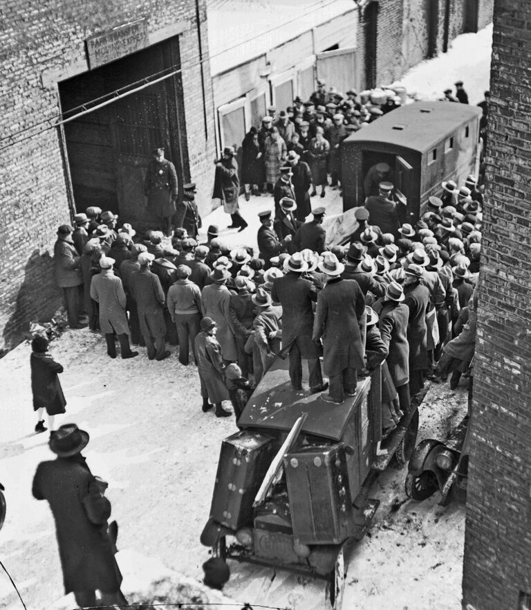 A crowd in the snow outside the Clark Street garage as the victims' bodies are brought out, February 14, 1929