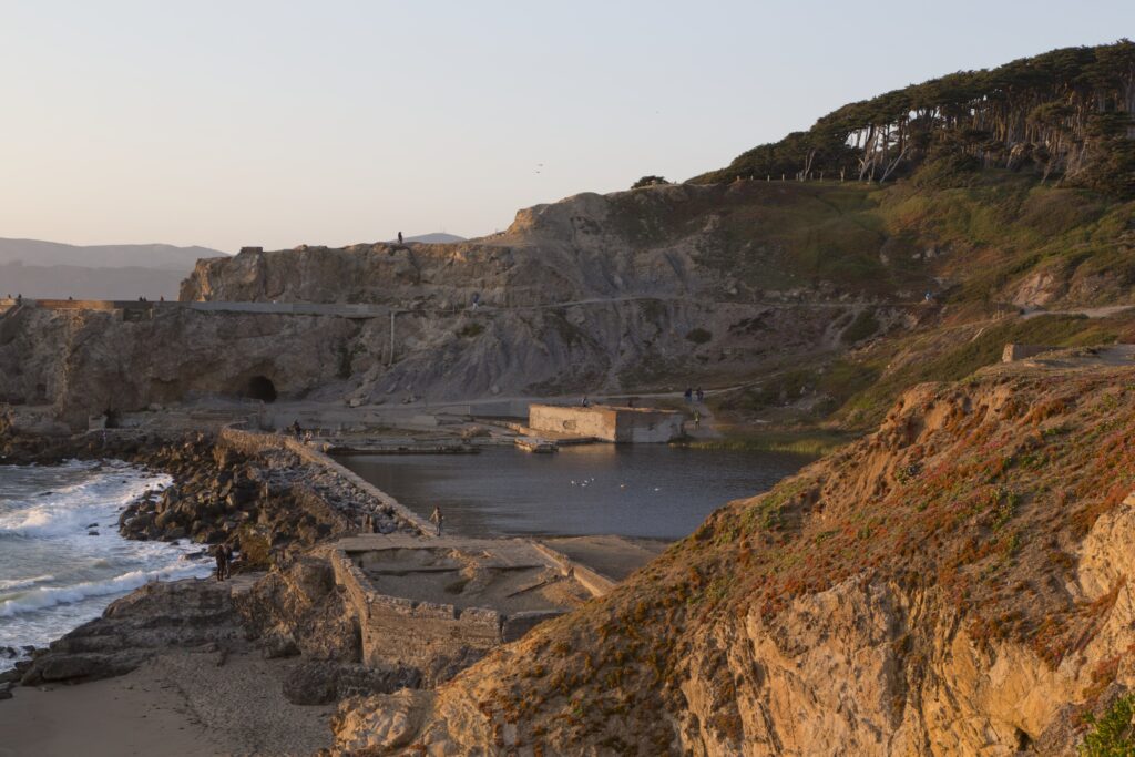 The concrete ruins of the Sutro Baths pools beside the ocean
